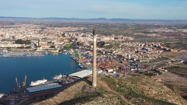 chimney aerial shot Cartagena Spain sunny day industrial area mediterranean sea port