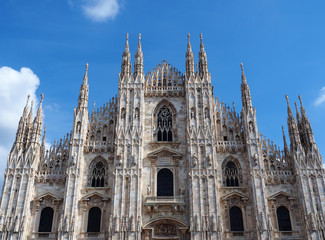 Fototapeta premium View of the exterior of the Milan Cathedral (Duomo di Milano) in Milan, Italy. It is dedicated to the Nativity of St Mary (Santa Maria Nascente).