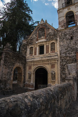 Fototapeta na wymiar Facade Of Parish of Our Lady of Loreto, inside the Hacienda of Santa María Regla, in Huasca Mexican Town 