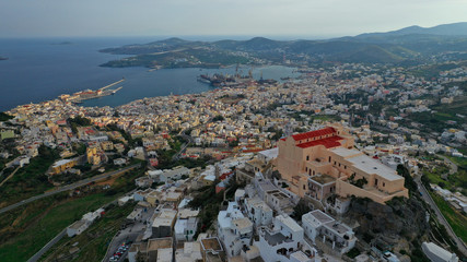 Aerial drone photo of iconic uphill catholic settlement of ano Syra featuring church of Saint...