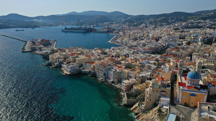 Aerial drone photo of pictruesque district built by the sea of Vaporia in main town of Syros or Siros island Ermoupolis near famous church of Agios Nikolaos, Cyclades, Greece