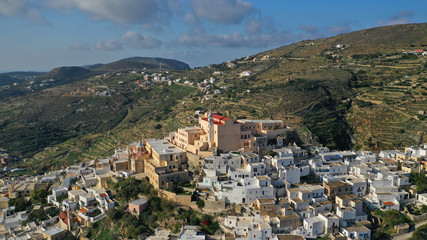 Obraz premium Aerial drone photo of iconic uphill catholic settlement of ano Syra featuring church of Saint George with beautiful colours, Syros or Siros island, Cyclades, Greece