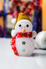 Christmas toys for the Christmas tree, balls, stars. Textures and backgrounds. New Year's toy snowman