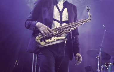 Elegant Saxophonist in a live music show 