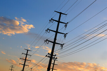 High voltage tower, silhouetted in the evening