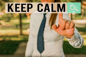 Writing note showing Keep Calm. Business concept for not get emotionally invested in situations you cannot control over Handsome business girl pointing with finger into empty space