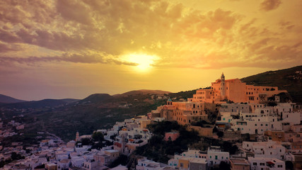Aerial drone photo of iconic uphill Catholic settlement of ano Syra featuring church of Saint...