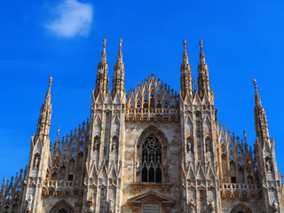 Naklejka premium View of the exterior of the Milan Cathedral (Duomo di Milano) in Milan, Italy. It is dedicated to the Nativity of St Mary (Santa Maria Nascente).