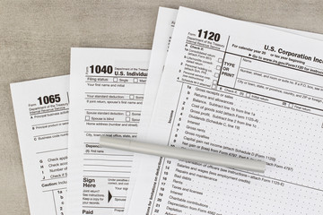 Tax form business financial concept: macro view of individual return tax form and ballpoint pen