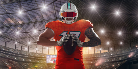 American football players on professional stadium on sunset.