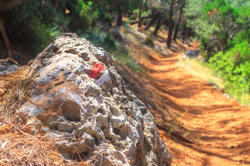 Summer landscape - view of the marking of the hiking trail on the Lycian Way, Cape Gelidonya, Antalya Province in Turkey