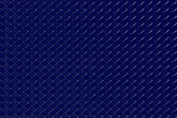 Navy blue leather background with imitation weave texture. Glossy dermantine, artificial leather structure. Fake woven leather wicker textured surface.