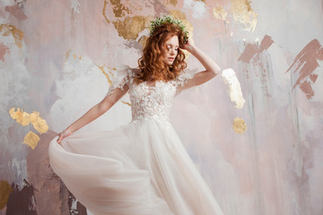 Elegant red-haired girl bride. Young beautiful woman in wedding dress
