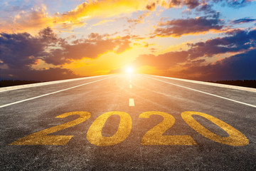Empty asphalt roads and the New Year 2020 concept. The 2020 number on the straight highway.