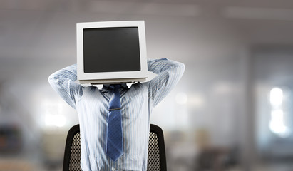 Monitor headed businessman. Mixed media