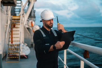 Marine Deck Officer or Chief mate on deck of offshore vessel or ship , wearing PPE personal...