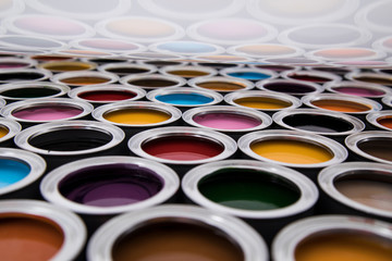 Fototapeta premium Rainbow, tin metal cans with color paint