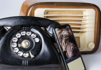 50s telephone and radio and modern smart phone - obrazy, fototapety, plakaty