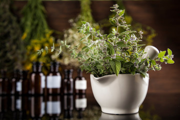 Natural medicine in black mirror background