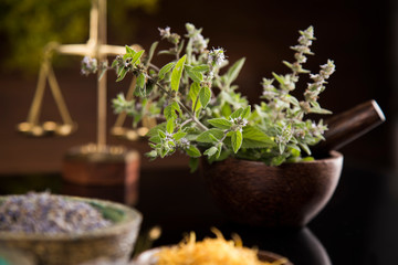 Natural medicine in black mirror background