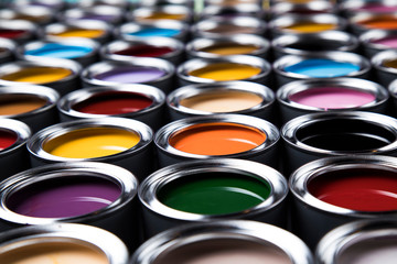 Group of tin metal cans with color paint