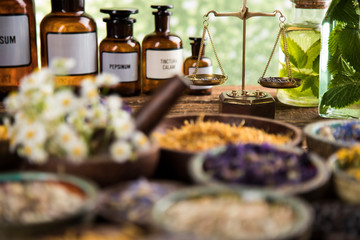 Herbs medicine and vintage wooden background