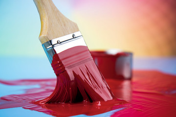 Metal tin cans with color paint and paintbrush