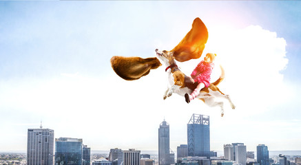 Super hero and her flying dog
