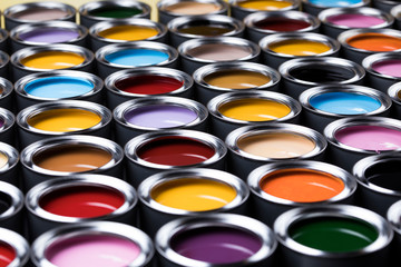 Group of tin metal cans with color paint