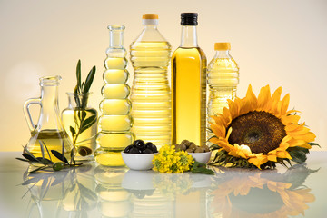 Healthy oil from sunflower, olive, rapeseed oil. Cooking oils in bottle - obrazy, fototapety, plakaty