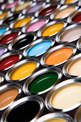 Group of tin metal cans with color paint