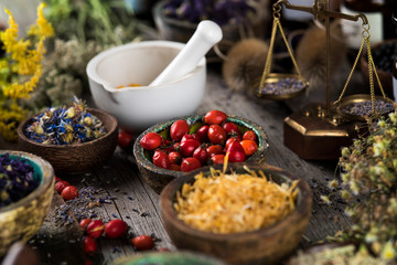 Herbs medicine and vintage wooden background