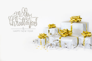 Christmas banner. Xmas silver gifts box with gold bows, white background. Horizontal poster, greeting card, headers, website. Decoration objects.