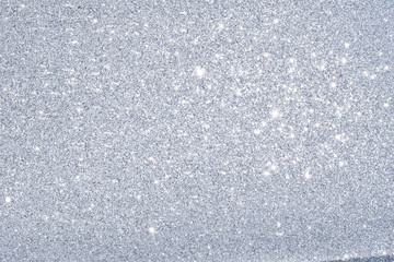 sparkles of silver glitter texture background
