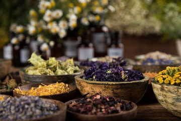 Herbs medicine and vintage wooden background