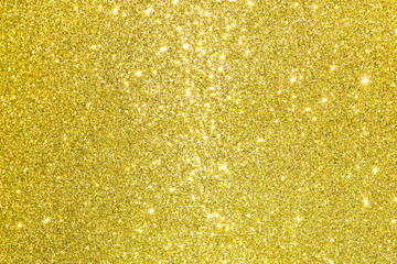 sparkles of golden glitter texture background