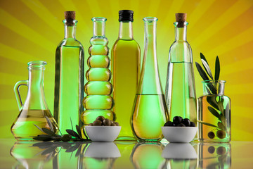Olive oil bottles, olive branch and Cooking oils