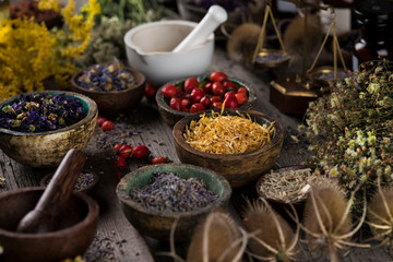 Herbs medicine and vintage wooden background