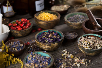 Herbs medicine and vintage wooden background