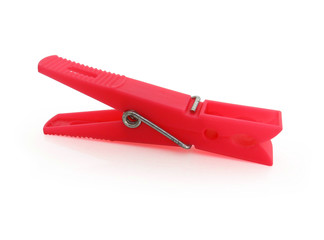 Isolated green  plastic clothespin on white background.