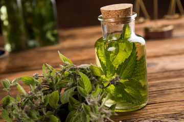 Oil and Natural medicine, wooden table background