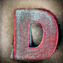 old wooden letter D in a box with Christmas stars 