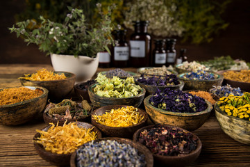 Herbs medicine and vintage wooden background
