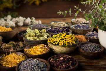 Herbs medicine and vintage wooden background