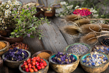 Herbs medicine and vintage wooden background