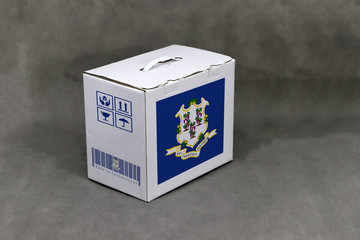 Connecticut flag on white box and state flag barcode with fragile symbol on grey background. The concept of export trading from Connecticut.