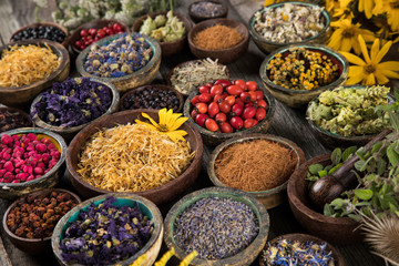 Herbs medicine and vintage wooden background