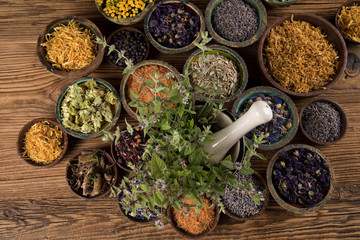 Herbs medicine and vintage wooden background