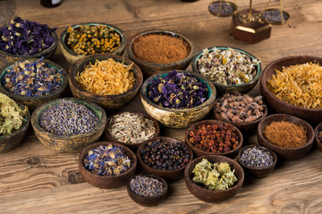 Herbs medicine and vintage wooden background
