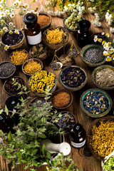 Herbs medicine and vintage wooden background